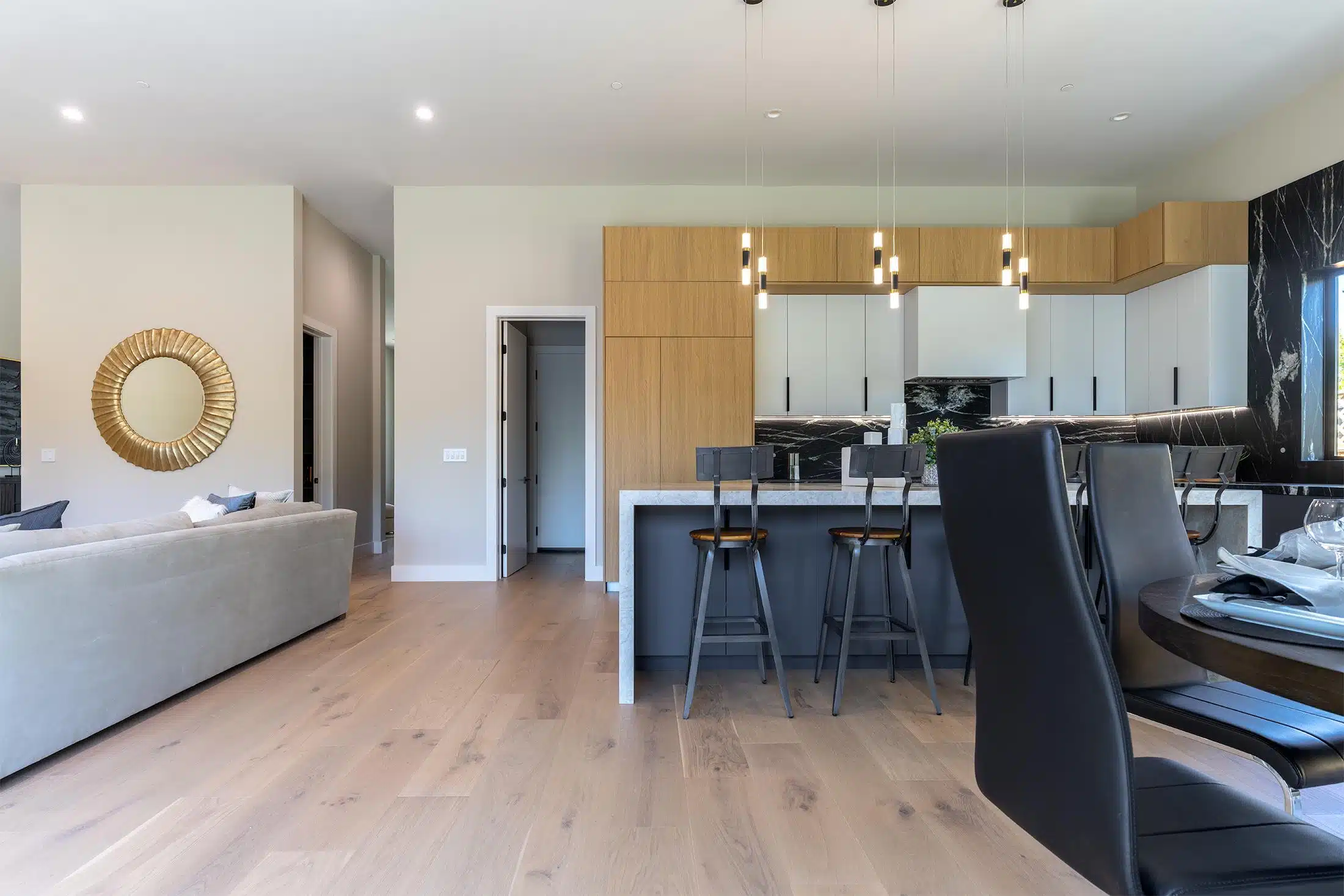 Open-plan living room and kitchen sharing continuous flooring